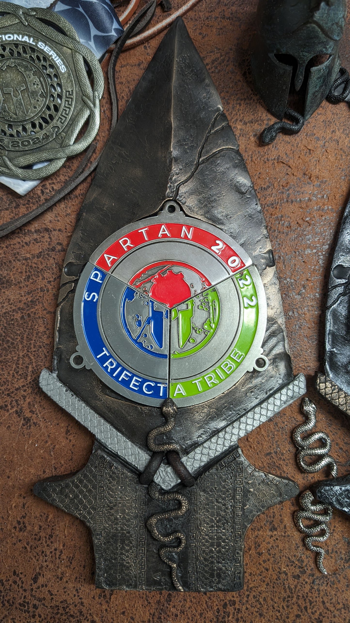 Spartan Race Spear 2024 SNAKE DESIGN Spartan Trifecta Medal display with real leather, an intricate snake, and snake scales and DR skulls